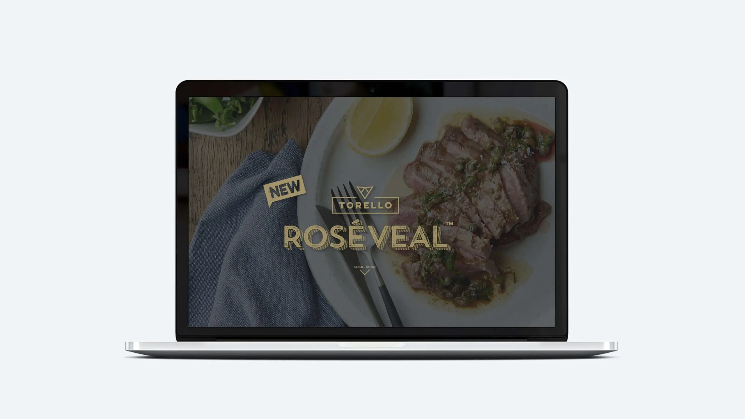 Torello Rosé Veal on laptop: premium beef, elegant dining concept.