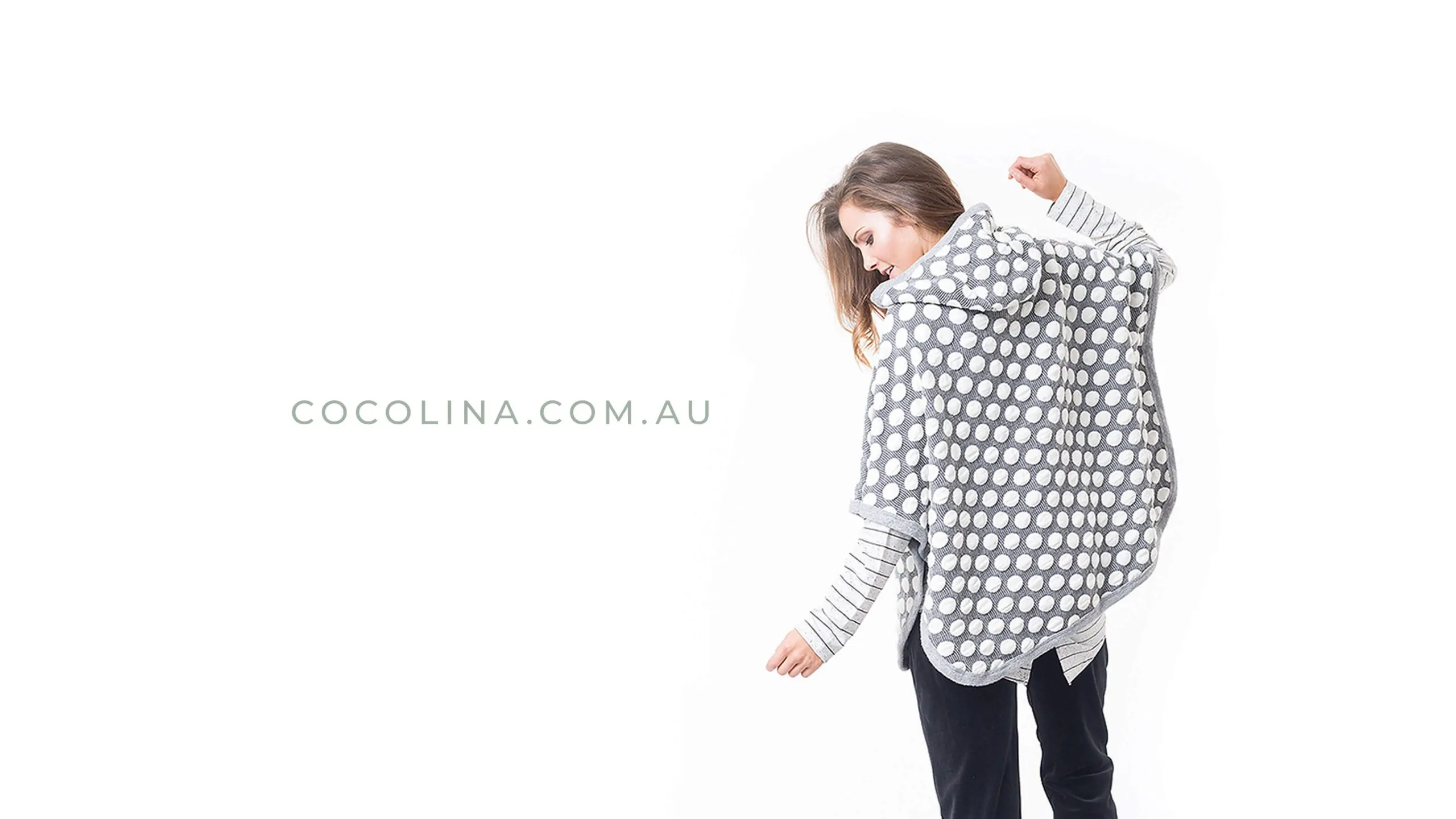 Woman wearing a stylish polka dot wrap with 'cocolina.com.au' text.